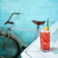 Tropical rum punch cocktail with pineapple and citrus, served in a zombie glass